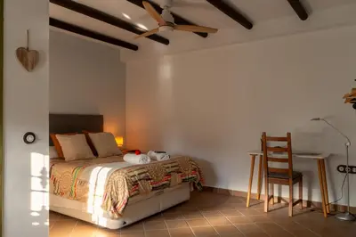 Cama o camas de una habitación en El Pinsapo Casa Rural