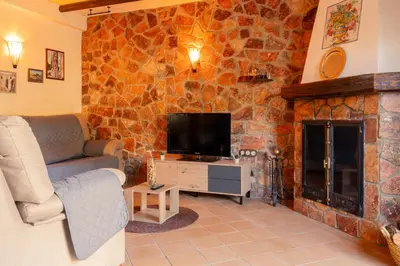 Una televisión o centro de entretenimiento en El Pinsapo Casa Rural