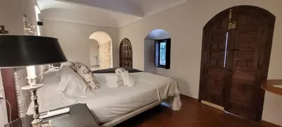Cama o camas de una habitación en Palacio de los Angulo casa histórica en el centro de Córdoba