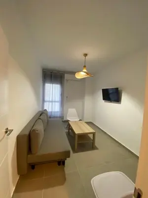 Una televisión o centro de entretenimiento en 9752 Apartamento Corte Ingles