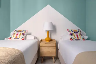 Cama o camas de una habitación en Misterhost Sol de Sevilla
