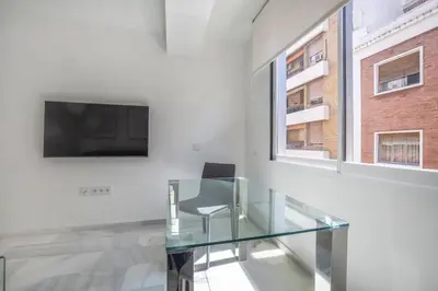 Una televisión o centro de entretenimiento en Apartamentos Haranas II & Parking