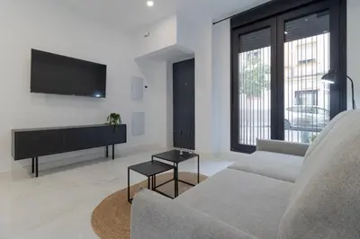 Una televisión o centro de entretenimiento en Loft Ana Belen Home