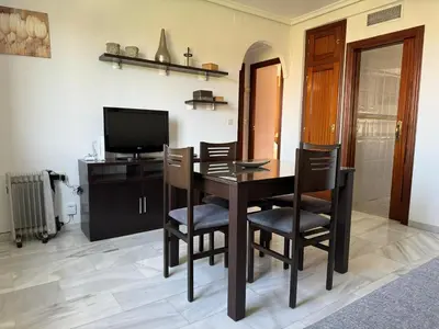 Una televisión o centro de entretenimiento en Apartamento Gran Vía Parque 7