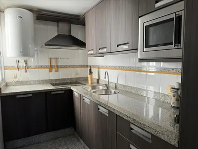 Una cocina o zona de cocina en Apartamento Gran Vía Parque 7