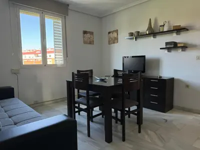 Una televisión o centro de entretenimiento en Apartamento Gran Vía Parque 7
