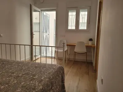 Cama o camas de una habitación en Apartamento con WiFi y aparcamiento privado