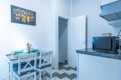 Una cocina o zona de cocina en AL-QUIVIR Suites