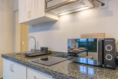 Una cocina o zona de cocina en AL-QUIVIR Suites
