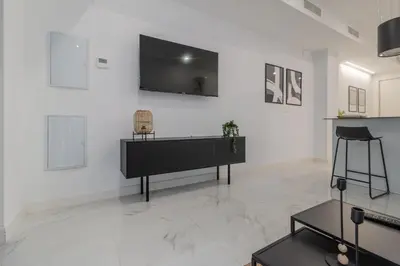 Una televisión o centro de entretenimiento en Loft Toñi Home