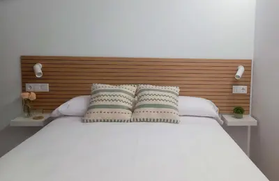 Cama o camas de una habitación en La Alcoba