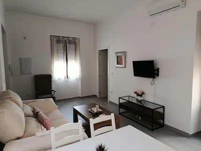 Una televisión o centro de entretenimiento en Apartamento Centro