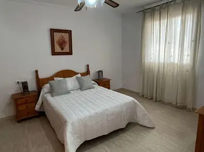Cama o camas de una habitación en CH Apartamentos Luque