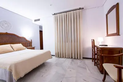 Cama o camas de una habitación en Hotel Los Omeyas