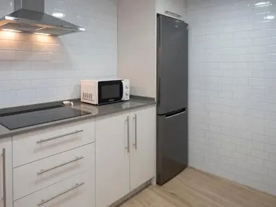 Una cocina o zona de cocina en Apartamentos La Fuensanta