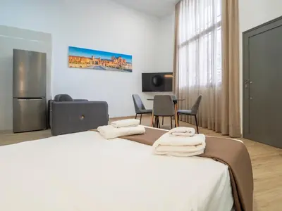 Una televisión o centro de entretenimiento en Apartamentos La Fuensanta