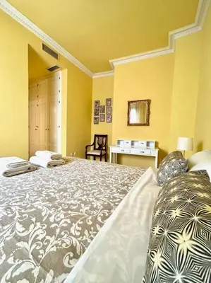 Cama o camas de una habitación en Hispalis patio Casa de Pilatos