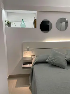 Cama o camas de una habitación en Apartamento Hoomtur Sevilla