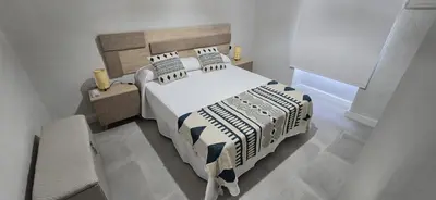 Cama o camas de una habitación en El balcón del puente romano
