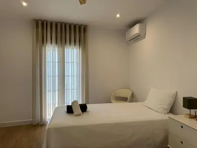 Cama o camas de una habitación en Balcón de los Patios con PARKING