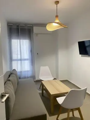 Una televisión o centro de entretenimiento en 9762 Apartamento Corte