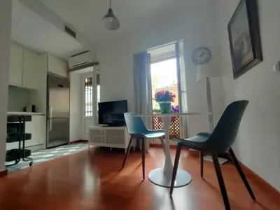 Una televisión o centro de entretenimiento en Alameda 1 dormitorio
