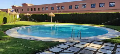 Piscina en o cerca de APARTAMENTOS FIBES GARDEN SEVILLA