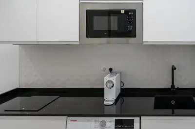Una cocina o zona de cocina en ALCANTARA LOFT - alojamiento turístico