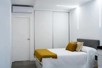Cama o camas de una habitación en ALCANTARA LOFT - alojamiento turístico