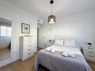 Cama o camas de una habitación en San Cayetano Apartment