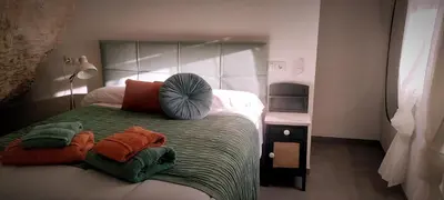 Cama o camas de una habitación en Casa Cueva Las Chicas del Puente