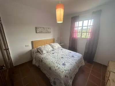 Cama o camas de una habitación en La casita del Cabaña