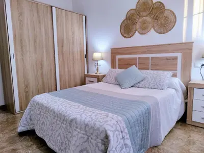 Cama o camas de una habitación en Alojamiento La Palmera