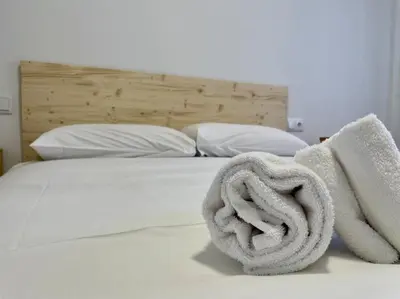 Cama o camas de una habitación en Geysotur Barrios
