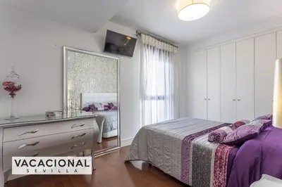 Cama o camas de una habitación en Ilusion Sevilla
