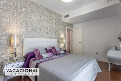 Cama o camas de una habitación en Ilusion Sevilla