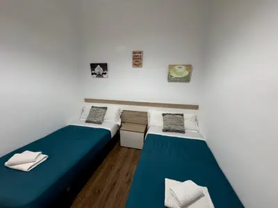 Cama o camas de una habitación en Apartamento Céntrico Puente Romano
