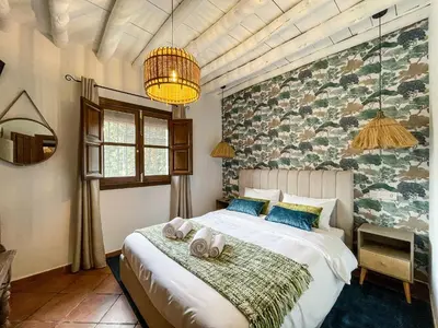Cama o camas de una habitación en Villa Los Arrendajos, privacy in de natuur in Granada