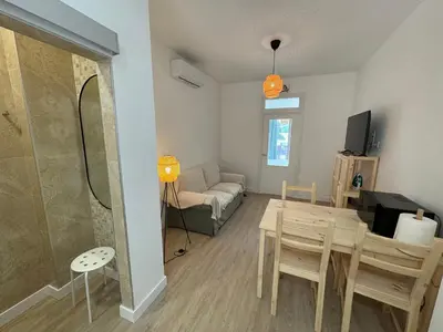 Una televisión o centro de entretenimiento en Apartamento Búho - Junto al Castillo