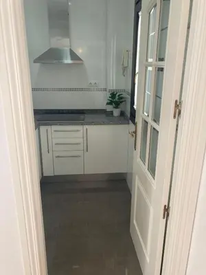 Una cocina o zona de cocina en Rialto céntrico patio sevillano