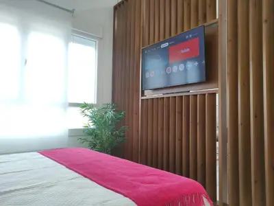 Cama o camas de una habitación en The Urban Elegance Suite