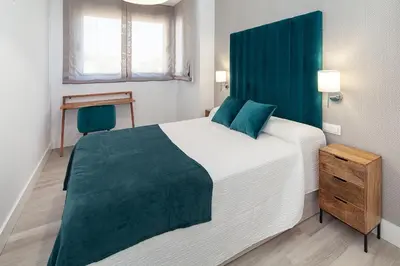 Cama o camas de una habitación en Espectacular piso en Nervión