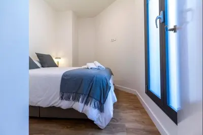 Cama o camas de una habitación en Alohamundi Puerta Osario II