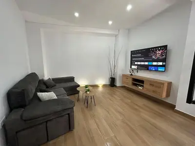 Una televisión o centro de entretenimiento en Casa Calle Pilar