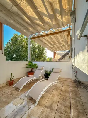 Un balcón o terraza de Charming 2 Bedroom Boutique Triplex Apartment with Private Terrace at Seville City Center by OCityzen