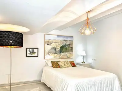 Cama o camas de una habitación en Charming 2 Bedroom Boutique Triplex Apartment with Private Terrace at Seville City Center by OCityzen