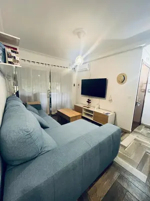 Una televisión o centro de entretenimiento en Lovely Rooms en piso compartido