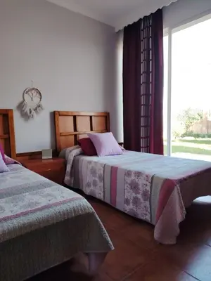 Cama o camas de una habitación en Villa Santa Ana