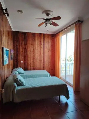 Cama o camas de una habitación en Villa Santa Ana