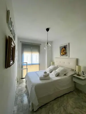 Cama o camas de una habitación en Tu oasis de lujo junto al Guadalquivir